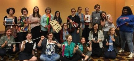 Girl Scouts and STEM volunteers pose for a group photo
