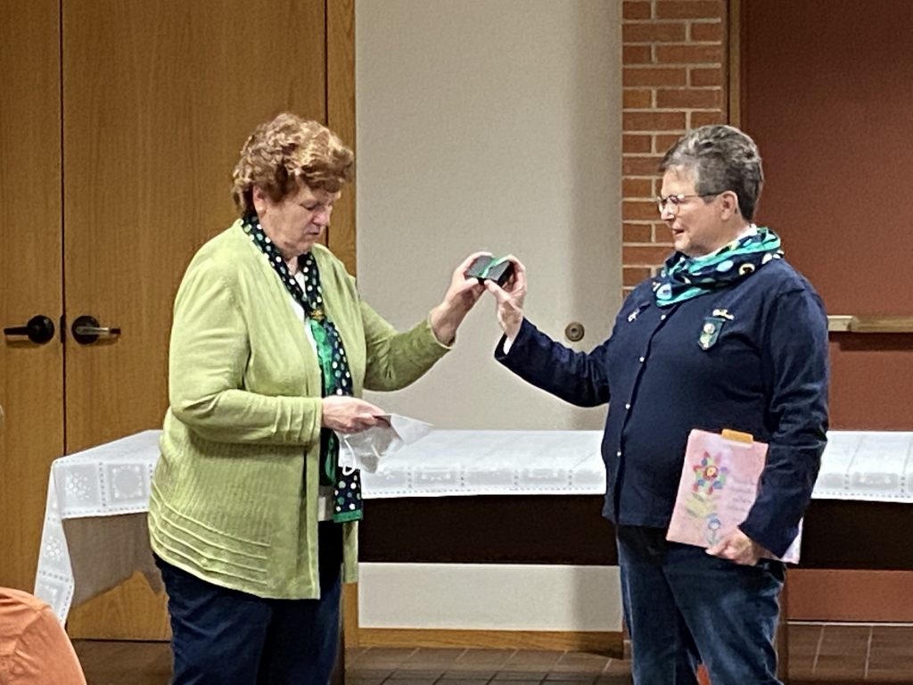 Amy Jo Jensen receiving her award at the Service Unit Leader Meeting